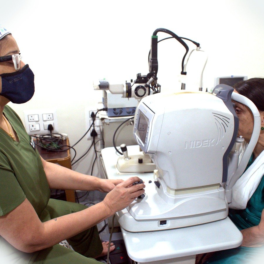 Patient eye checkup with specialist equipment